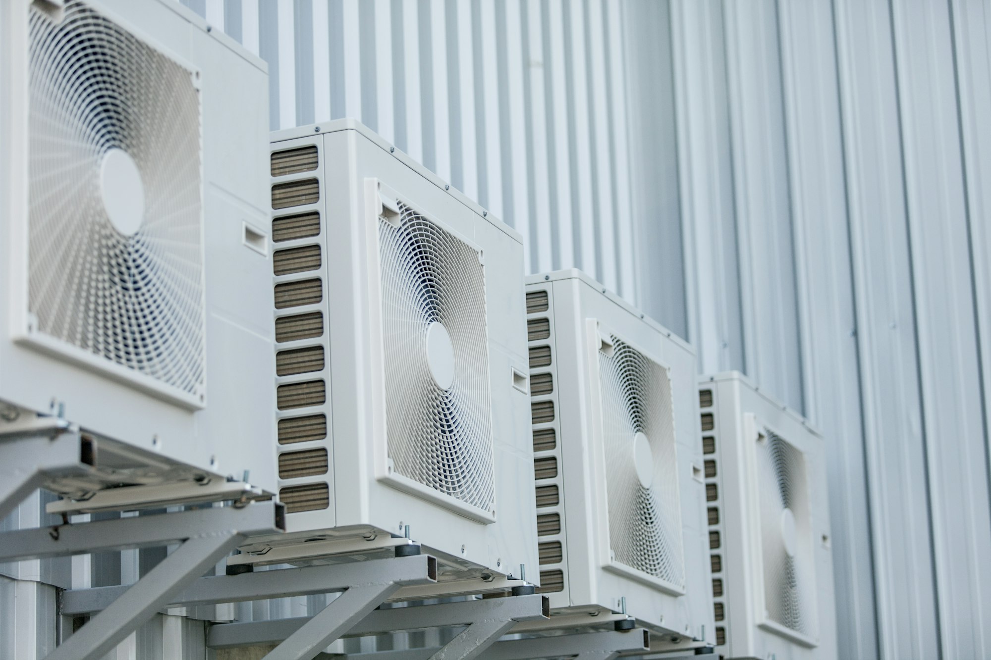 Closeup of air conditioners installed on the outside wal